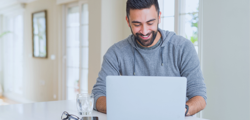 Man using notebook to apply for credit card